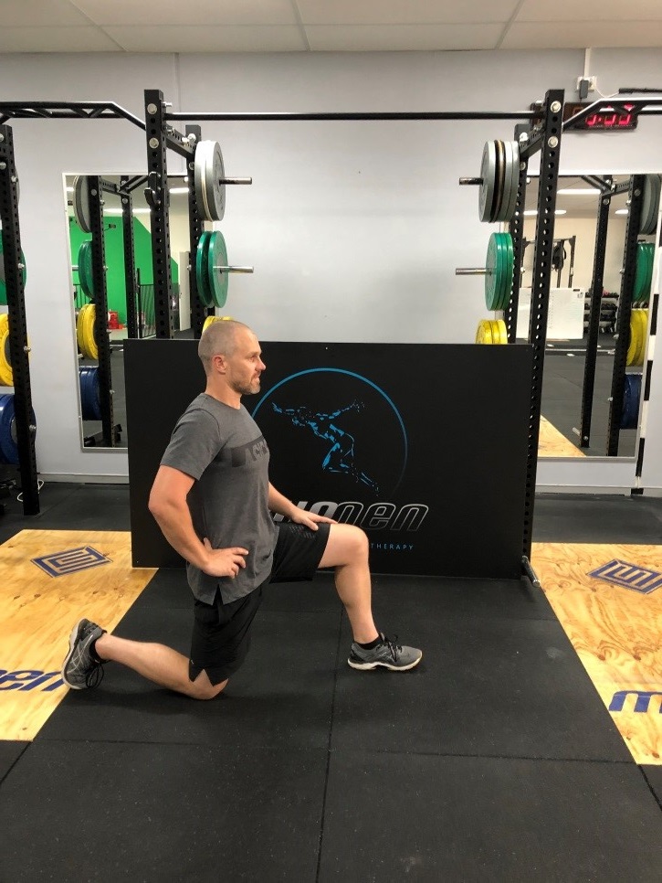 Antony Choice, Director and Soft Tissue Therapist at Myogen, demonstrating a hip flexor stretch.