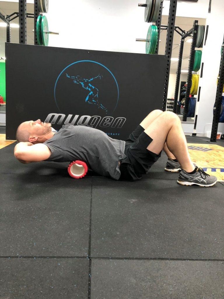 Antony Choice, Director and Soft Tissue Therapist at Myogen, demonstrating a foam roller stretch.