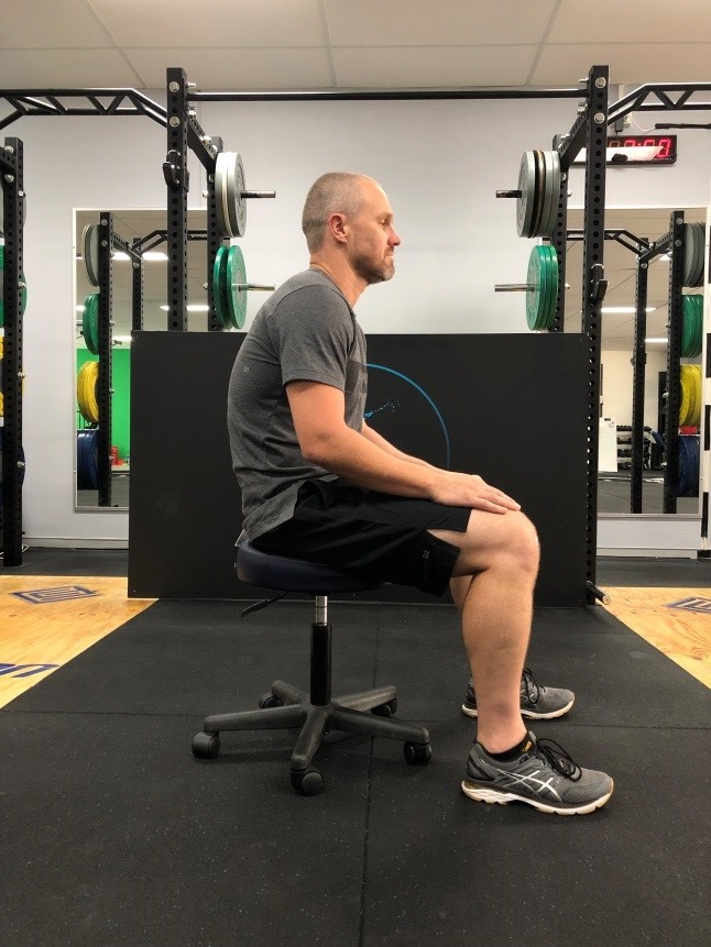 Antony Choice, Director and Soft Tissue Therapist at Myogen, demonstrating poor posture (slouching).